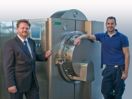 Inventor Sandy Sullivan, left, and engineering manager Craig Sinclair with the resomator, a device that dissolves human remains without the need for the high heat of cremation.