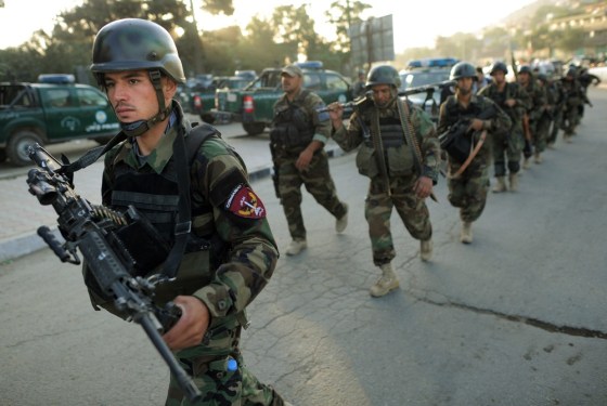 Image: Afghan soldiers walk towards the Intercontinental hotel