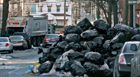 Image: Trash piled higher than cars in New York