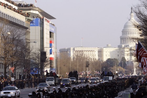 The car carrying Barack Obama proceeds down Pennsylvania Avenue on January 20, following his inaugural address at the Capitol.