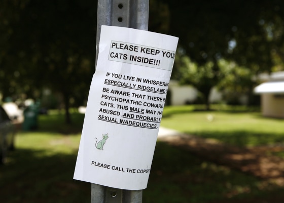 Image: A sign warning owners of cats to keep them inside