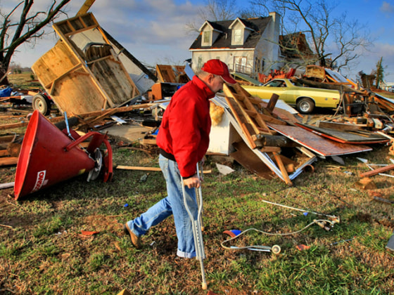 Image: Robert Skinner surveys his destroyed home