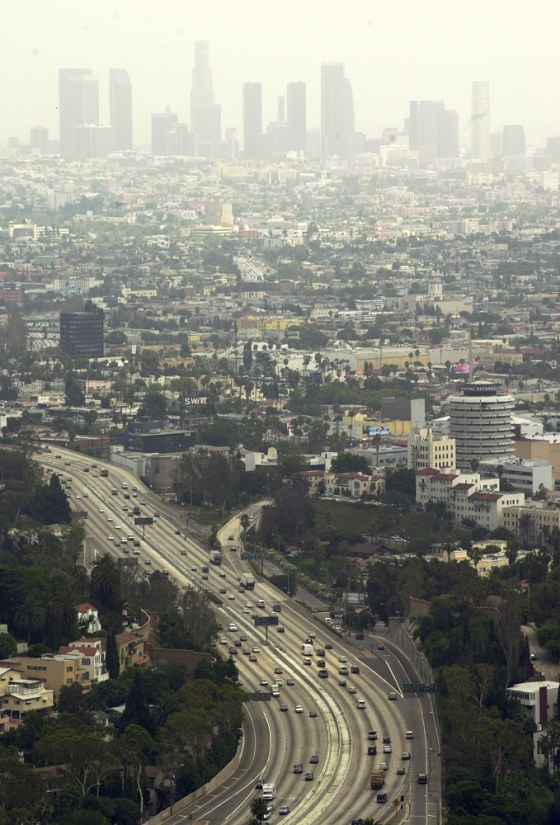 Image: Los Angeles skyline is obscured by a heavy layer of smog and fog