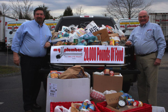 Mark and Wendell Presgrave with some of the collected food that will be distributed to needy people in the D.C. metropolitan area.