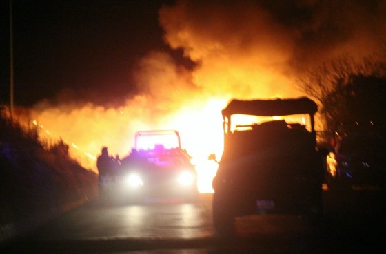 Image: Federal Police officers stand by a block