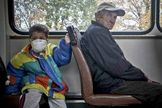 Image: A school boy and an elderly man from Kol