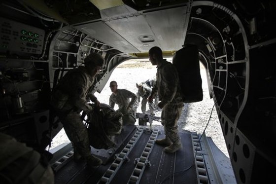 U.S. soldiers heading to a forward operating base in the Zabul province of Afghanistan load their gear Wednesday onto a Chinook helicopter.