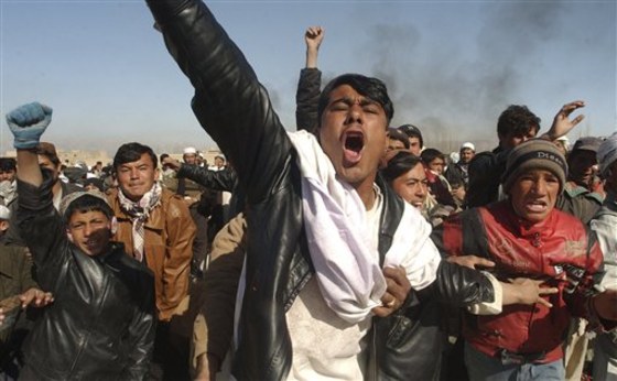 Afghan men shout anti-U.S. slogans during a demonstration against coalition forces in Ghazni, southwest of Kabul, on Friday.