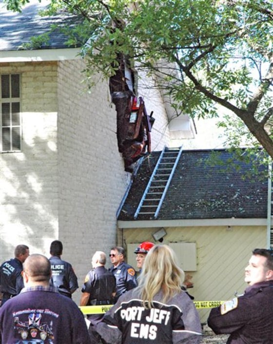CAR STUCK IN BUILDING