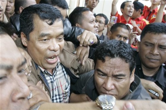 CORRECTION Indonesia Activist Murder