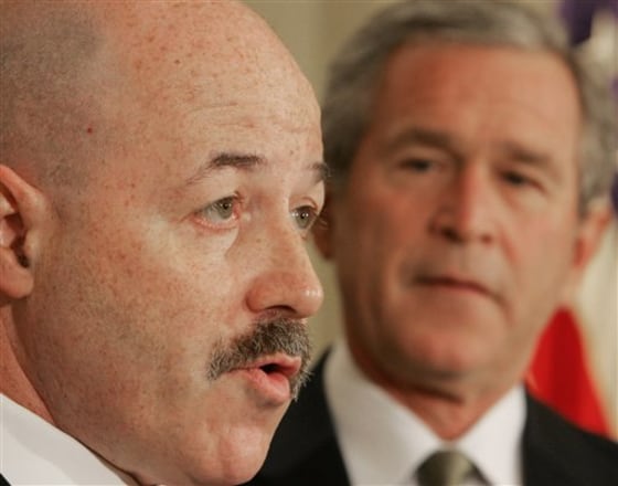 Former New York City Police Commissioner Bernard Kerik, left, speaks at the White House last week. Kerik made $6.7 million by selling stock given him by Taser International.