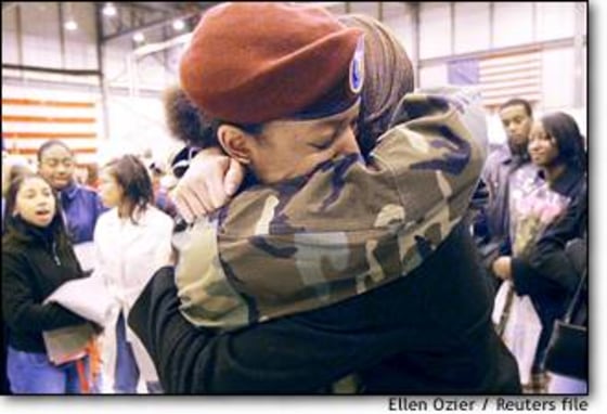 North Carolina Army National Guard Private 1st Class Brooklyn Dorsey, left, gets farewell hug from friend and sorority sister Nikki Nowlin, in Morrisville, N.C. last week.