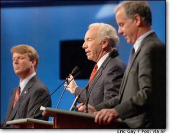 Sen. Joe Lieberman, D-Conn., center, speaks at the Albuquerque, N.M., debate. At left is Sen. John Edwards, D-N.C.; former Vermont Gov. Howard Dean is at right.