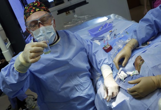 Dr. Alejandro Berenstein, Director at the Center for Endovascular Surgery in an operating room of New York's Roosevelt Hospital, Tuesday, March 5, 2013. (AP Photo/Richard Drew)