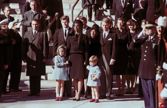 The First Family watches John F. Kennedy's funeral procession in Washington on Nov. 25, 1963.