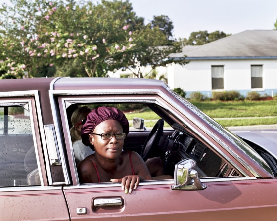 Mary Fudge in the passenger seat, on 13th Street, June, 2013.