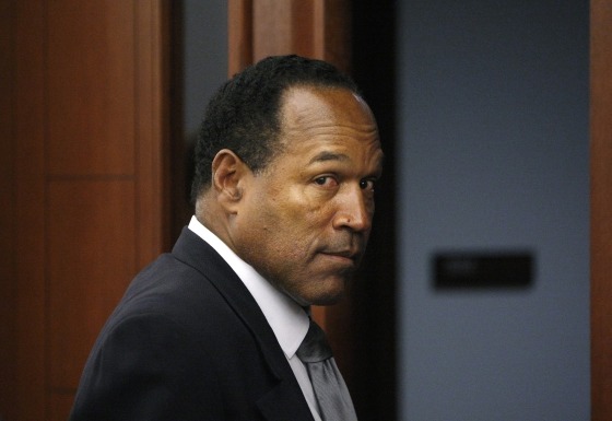 O.J. Simpson leaves the courtroom in Las Vegas, Nev., Sep. 22, 2008. Simpson faces 12 charges, including felony kidnapping, armed robbery and conspiracy. (Photo by John Locher/Reuters)