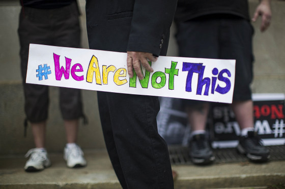 An opponent of a new state law that restricts transgender bathroom use and pre-empts local governments from creating their own related policies with a sign at a rally (Photo by Ray Whitehouse/The New York Times/Redux)