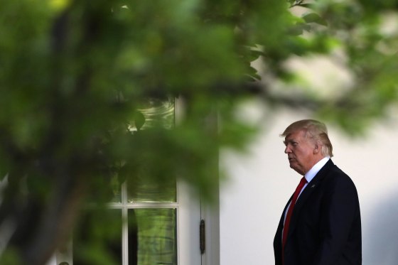 Image: U.S. President Donald Trump walks along the <a href=