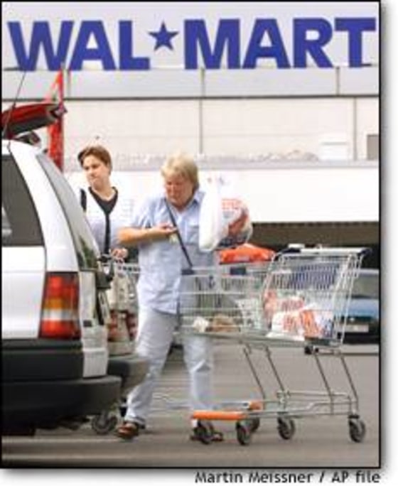 Customers load a vehicle in front of a Wal-Mart Supercenter in Dortmund, Germany, the retailer's first store to open in the country four years ago. While Wal-Mart has seen success in the U.K., its German locations have lagged.