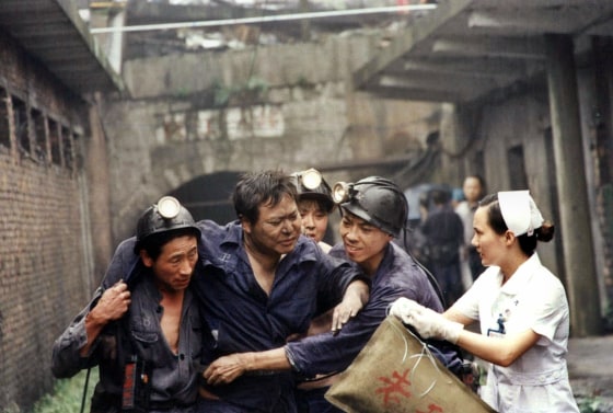 A Chinese miner is evacuated out of a coal mine pit after a gas leak in Loudi, China