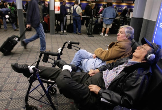 Image: Travelers waiting for delayed flights to resume