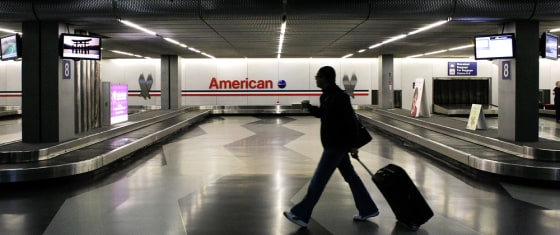 Image: Person with luggage in airport