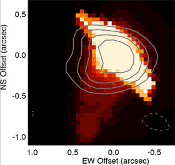 A Hubble Space Telescope image of visible light emitted by a protoplanetary disk in the Orion Nebula called proplyd 170-337 shows hot, ionized gas (red) surrounding and streaming off of a disk (yellow). The contours reveal the dust disk hiding within the hot gas. This protoplanetary disk has a mass more than one hundredth that of the sun, the minimum needed to form a Jupiter-sized planet. Credit: Bally et al 2000/Hubble Space Telescope & Eisner et al 2008/CARMA, SMA