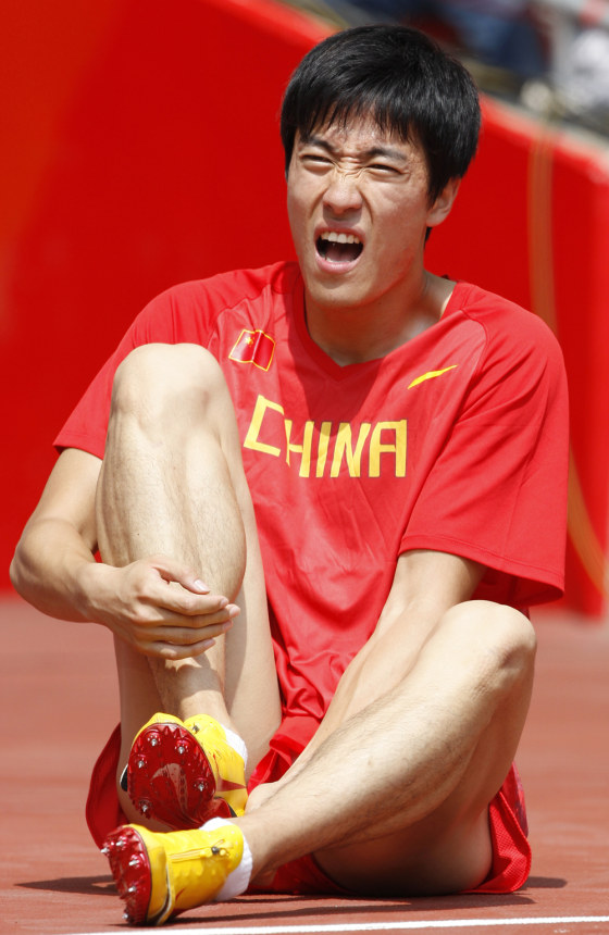 Image: China's Xiang Liu retires from the first round of the men's 110m hurdles