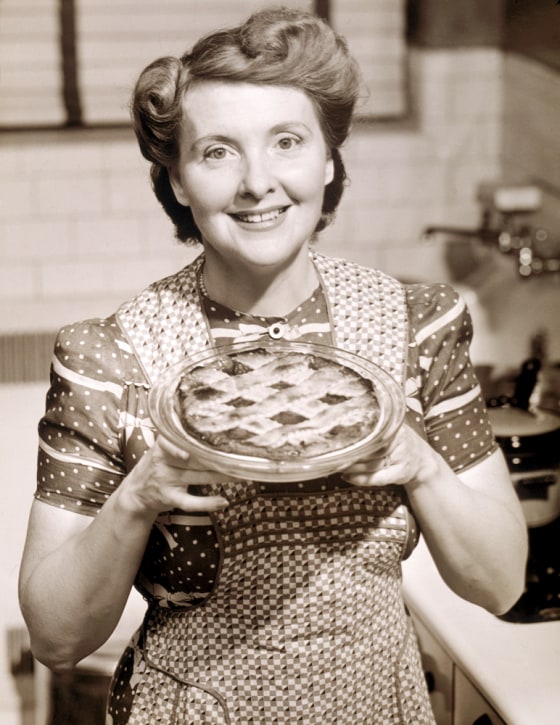 Image: Aproned Housewife Presents Homemade Pie