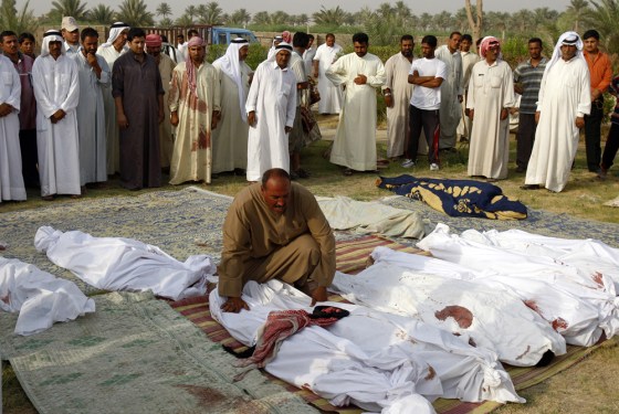 Image: Residents wait for the funeral of bomb attack victims in Baghdad