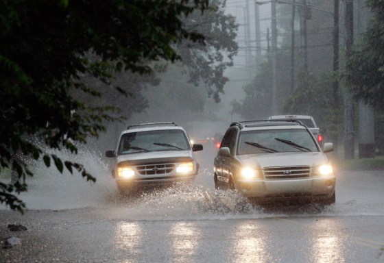 Image: Traffic passes through street flooding