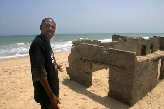Image: House abandoned five years ago to rising sea and sand, in Totope, Ghana