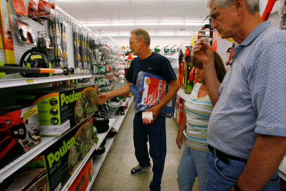 Owner Curtis Dosch, right, helps Billy and Sharon McCoy purchase a chainsaw, tarps and a few other supplies at the Ace Hardware in Ocean Springs, Mississippi.