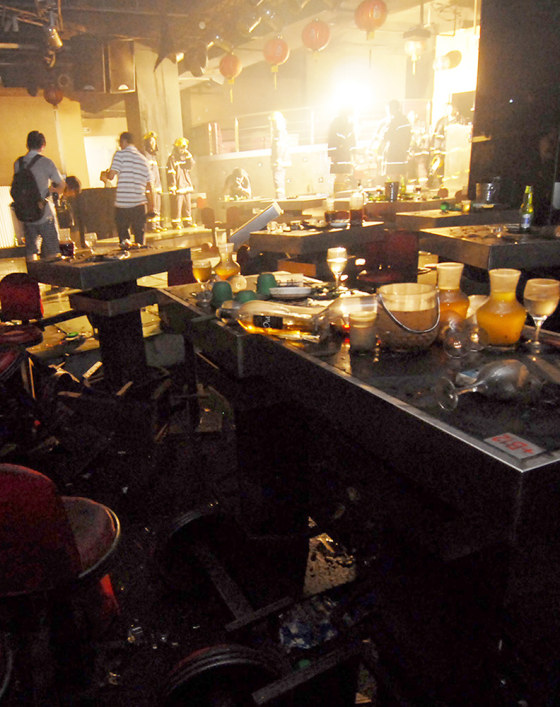 Chinese firefighters and investigators check the Dance King nightclub in Shenzhen near the border with Hong Kong on Sunday after a deadly fire.