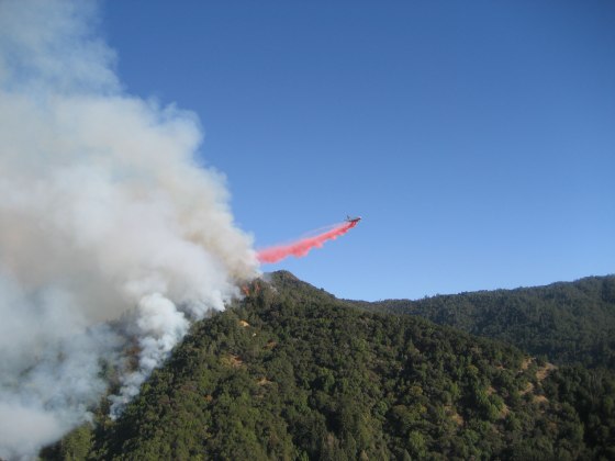 A DC-10 drops fire retardant on part of the fire in the Los Padres National Forest.