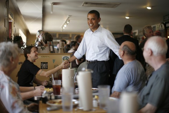 Image: Democratic presidential nominee Senator Barack Obama greets diners at a barbeque restaurant in Asheville