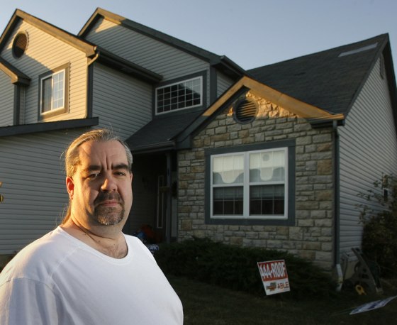 Jack Needles stands in front of his home in Hilliard, Ohio. Needles is facing his second layoff in six years amid weak economic conditions.