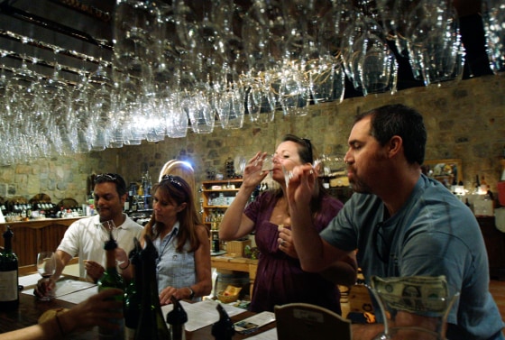 Visitors taste wine at the Torre di Pietra winery in Fredericksburg, Texas.