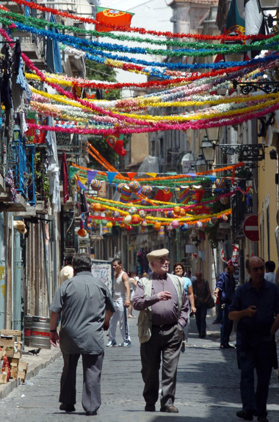 People walk through the colorful decorat