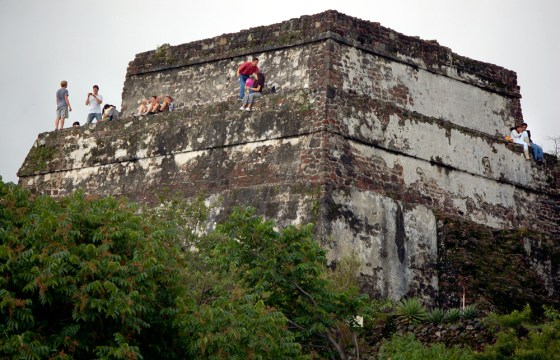 People relax atop the pyramid at the summit of the Tepozteco Hill, in Tepoztlan, Mexico. The 30-foot high pyramid dates back to the 12th century.