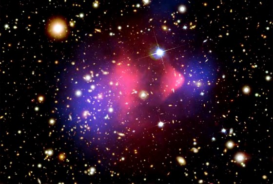 An image of the Bullet Cluster taken by NASA's Chandra X-ray telescope. Scientists claimed the image was proof of normal matter (pink) being separated from dark matter (blue). Another group now says the observations can be explained by a modified gravity of theory, and that dark matter is unnecessary.