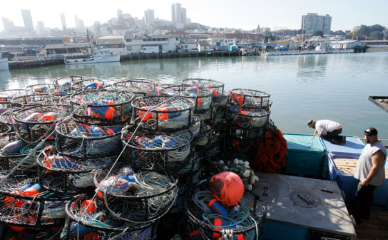 These crab fishermen were preparing their boats Tuesday for the San Francisco Bay season that began Thursday, but few fishermen actually ventured out due to concerns about the oil spill.