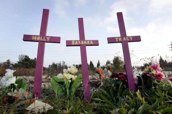 Image: Three crosses stand, surrounded by flowers, in Egg Harbor Township