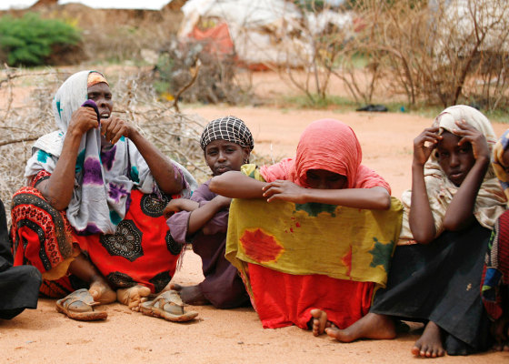 Image: Family members of a refugee from Ogaden region in Ethiopia sit on the ground in Dadaab, northeastern Kenya