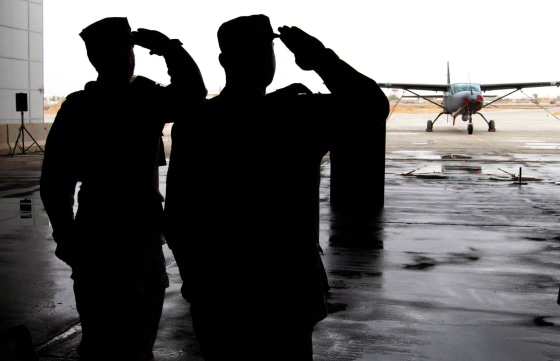Iraqi air force officers stand at attention during a ceremony to inaugurate a new flight school at Kirkuk Regional Air Base in Kirkuk.