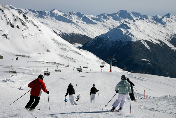 Skiers enjoy the perfect conditions with a lot of fresh fallen snow and blue skies on Nov. 18, on the Weissfluhjoch mountain above Davos in southeastern Switzerland. Due to the early and rich snowfalls many ski resorts in the Swiss mountains already opened for the new season.