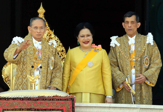 Thai King Bhumibol Adulyadej, left, waves to the crowds next to Queen Sirikit and Crown Prince Maha Vajiralongkorn during his 80th birthday celebrations at the Grand Palace in Bangkok on Wednesday. 