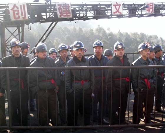 Rescuers prepare to search for victims at a coal mine where a gas blast took place in Hongtong county