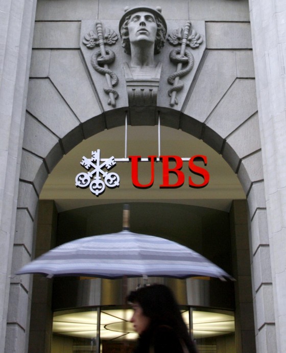 A woman walks past the UBS office at the Bahnhofstrasse in Zurich